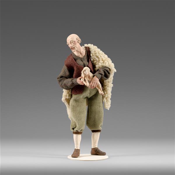 Shepherd with lamb in his arms - color