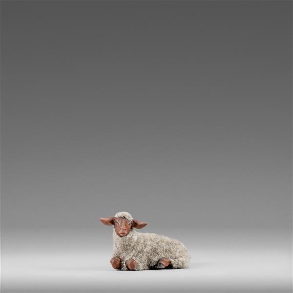 Sheep reclining with wool gray - color